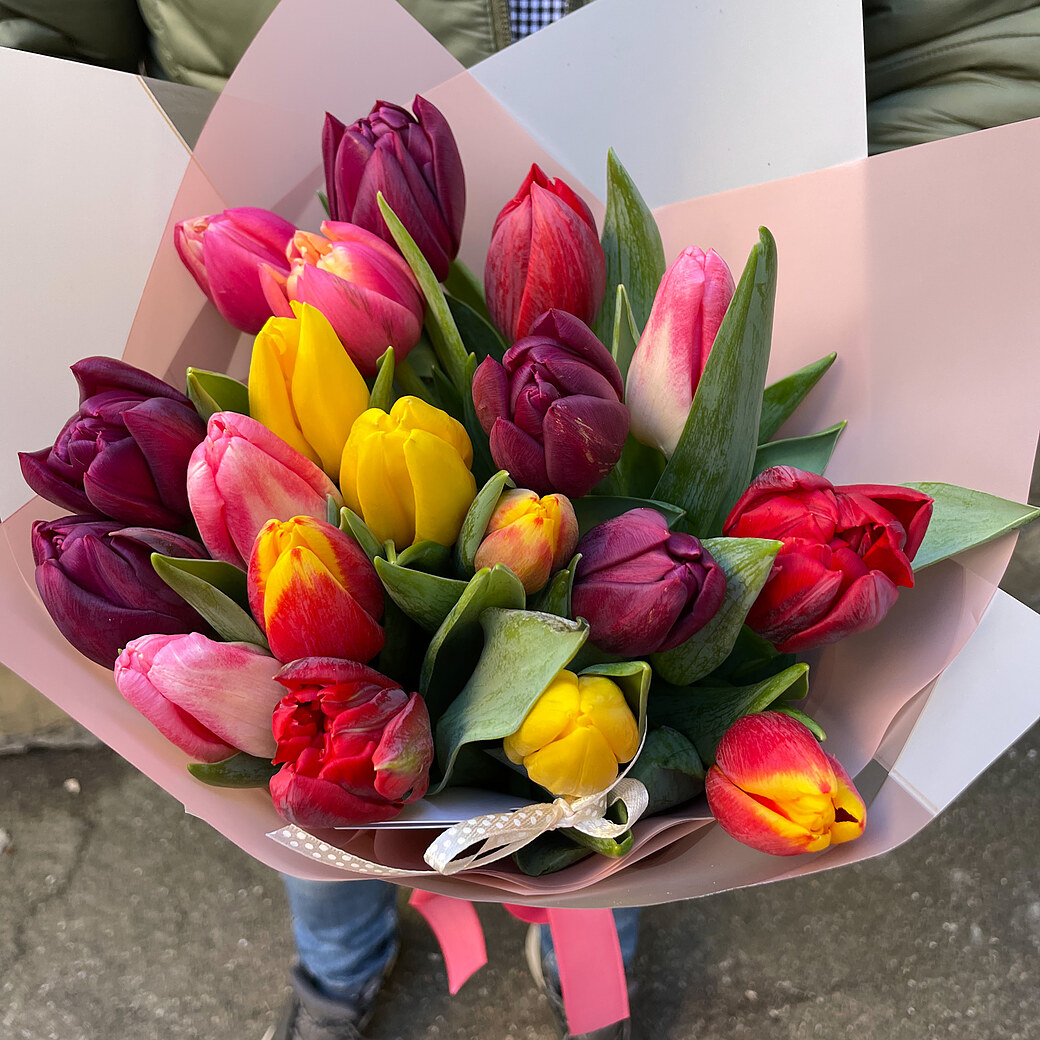 Tulips of different colors in decorative paper