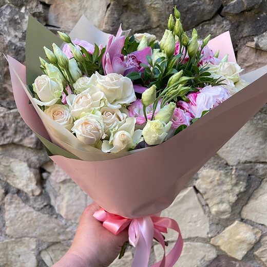 A bouquet of peonies, rose bushes, eustoma