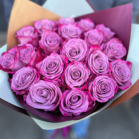 Purple roses in decorative packaging