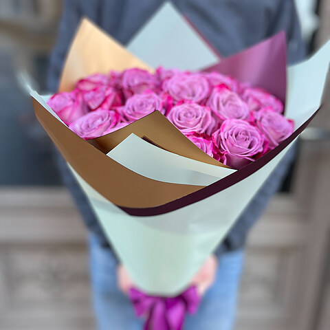 Purple roses in decorative packaging