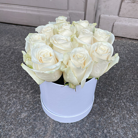 White roses in a round box