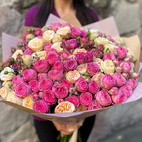 A bouquet of bush roses of different colors.