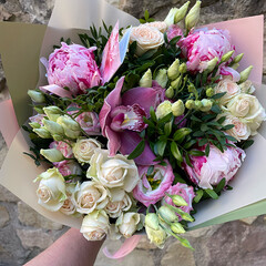 A bouquet of peonies, rose bushes, eustoma