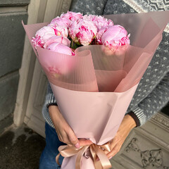 Pink peonies in decorative packaging