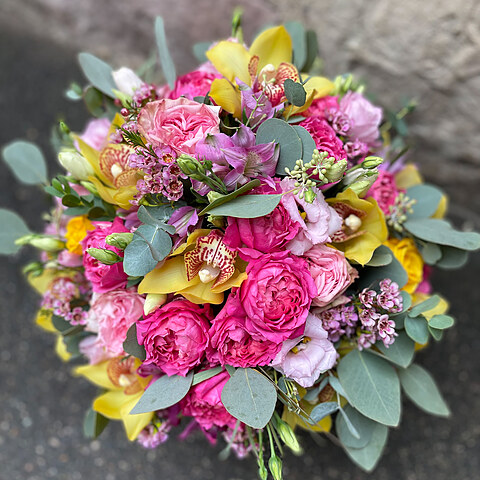 Bright composition of exotic flowers in a box